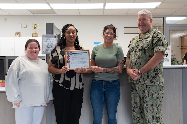 The front desk staff of Naval Health Clinic Cherry Point’s Patient Centered Medical Home was recognized for achieving 100% patient satisfaction for first quarter, 2025 during a ceremony held Friday, August 15 aboard the facility.