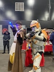 Crìsdean James Langan, left, poses dressed as the character Obi-Wan Kenobi from Star Wars at Comic Con Scotland in Edinburgh, Scotland, November 2022. Langan’s father took him and his sister to the event a few months before Langan began U.S. Air Force Basic Military Training. (Courtesy Photo)