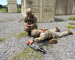 Army National Guard Soldiers assigned to the 430th EOD Company, part of the North Carolina Army National Guard, and the 387th EOD Company, Massachusetts Army National Guard, conduct measurements to aid in the identification of an unexploded ordnance item during platoon validation training of the 501st Ordnance Battalion held at Camp Dawson, W. Va., August 4, 2025.