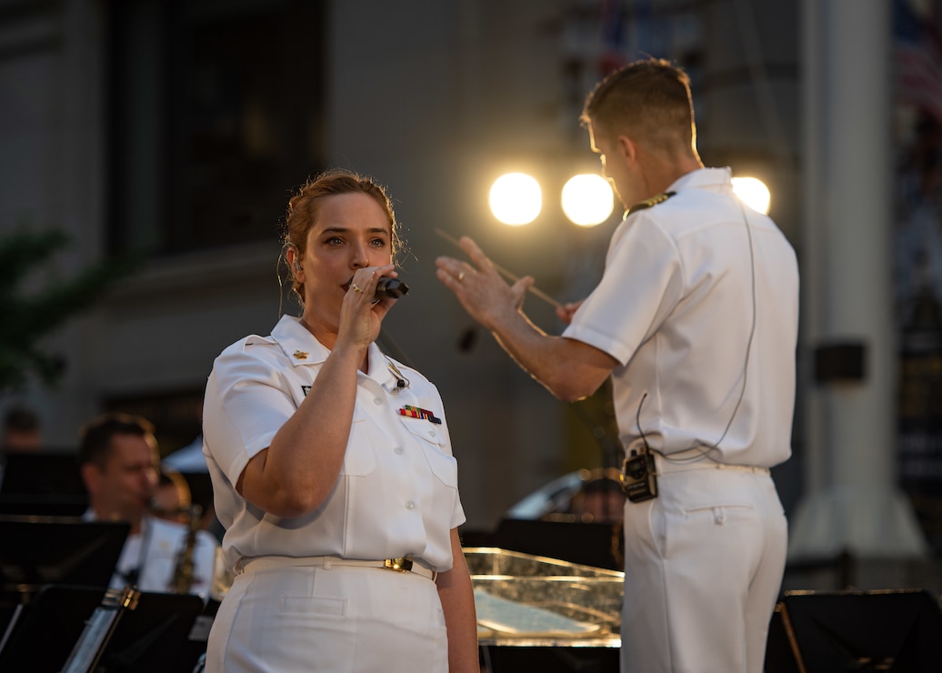 WASHINGTON (Aug 5, 2025) Members of the U.S. Navy Band perform during a concert on the avenue at the U.S. Navy Memorial. As we continue to celebrate the U.S. Navy's 250th birthday this year, events like these highlight the rich heritage, unwavering service, and strong sense of community that define our Navy. (U.S. Navy Photo by Mass Communication Specialist 1st Class Griffin Kersting)