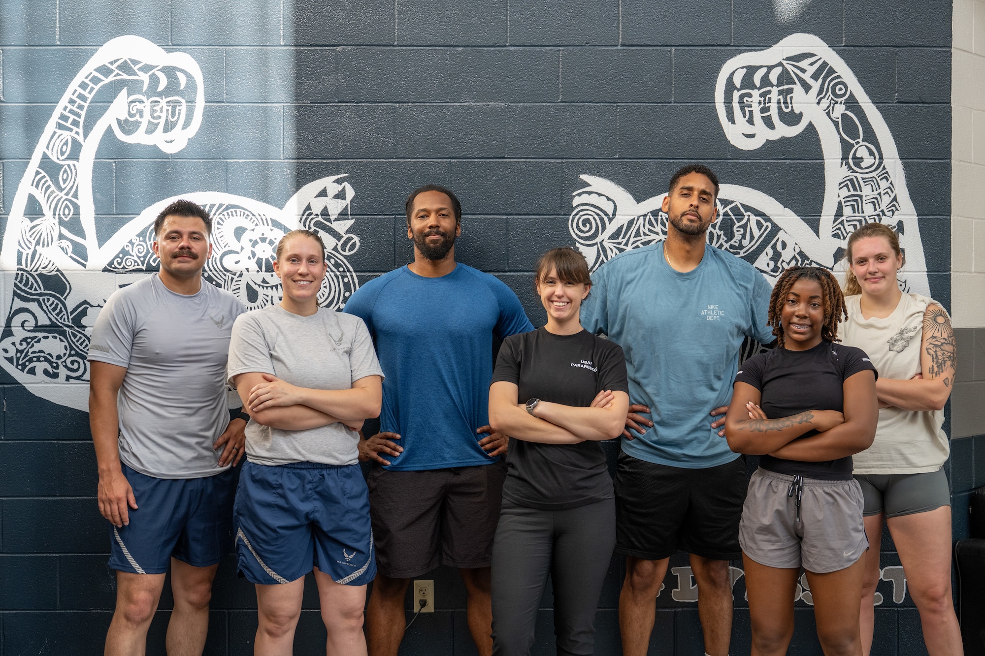 U.S. Air Force Airmen from the 28th Bomber Generation Squadron and members of the Dyess Operational Support Team pose for a photo after completing an advanced Physical Training Leader course at Dyess Air Force Base, Texas, Aug. 13, 2025. OST’s are specialized teams of experts, composed of a physical therapist, strength and conditioning coach, team lead and a mental health professional. (U.S. Air Force Photo by Airman 1st Class Caleb Schellenberg)