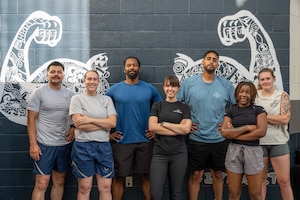 U.S. Air Force Airmen from the 28th Bomber Generation Squadron and members of the Dyess Operational Support Team pose for a photo after completing an advanced Physical Training Leader course at Dyess Air Force Base, Texas, Aug. 13, 2025. OST’s are specialized teams of experts, composed of a physical therapist, strength and conditioning coach, team lead and a mental health professional. (U.S. Air Force Photo by Airman 1st Class Caleb Schellenberg)