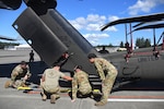U.S. Army National Guard Soldiers from 1st Battalion 168th General Support Aviation Regiment assist in UH-60 Black Hawk helicopter load up in support of Enduring Partners at Joint Base Lewis-McChord, Wash., August 13, 2025. Enduring Partners 2025 is an exercise taking place in Lop Buri Thailand, bringing together the Royal Thai Air Force, Washington Air National Guard and the Washington Army National Guard.