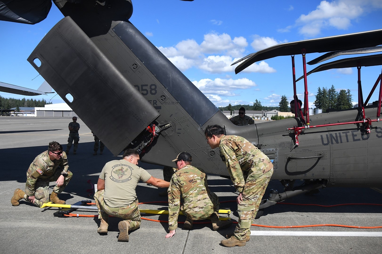 U.S. Army National Guard Soldiers from 1st Battalion 168th General Support Aviation Regiment assist in UH-60 Black Hawk helicopter load up in support of Enduring Partners at Joint Base Lewis-McChord, Wash., August 13, 2025.