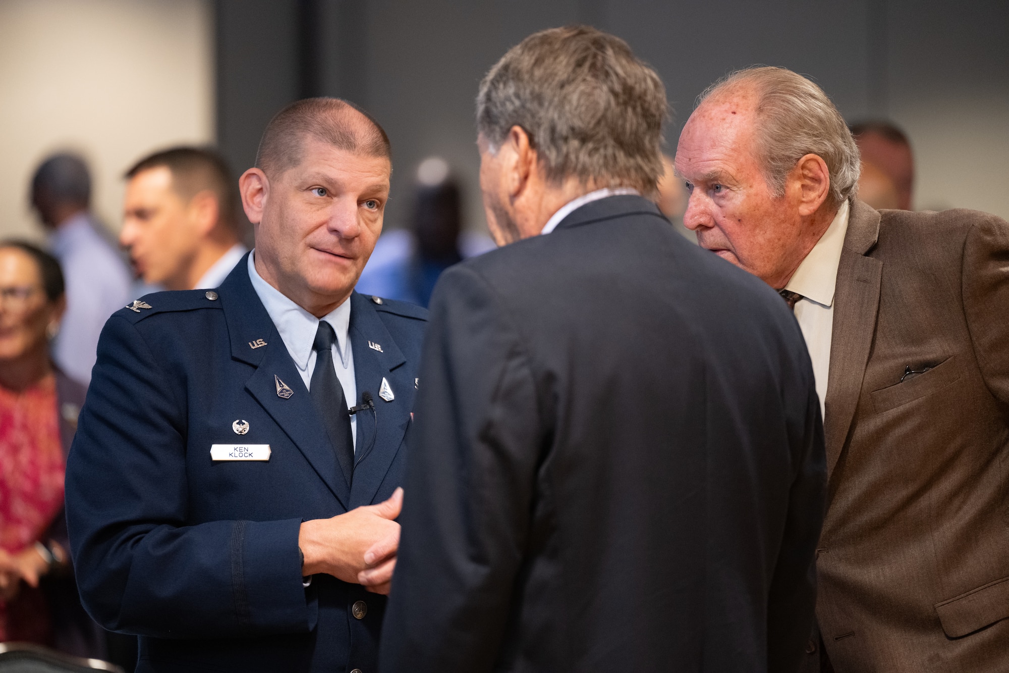 Col. Klock speaks with civic leaders during the State of the Bases event.