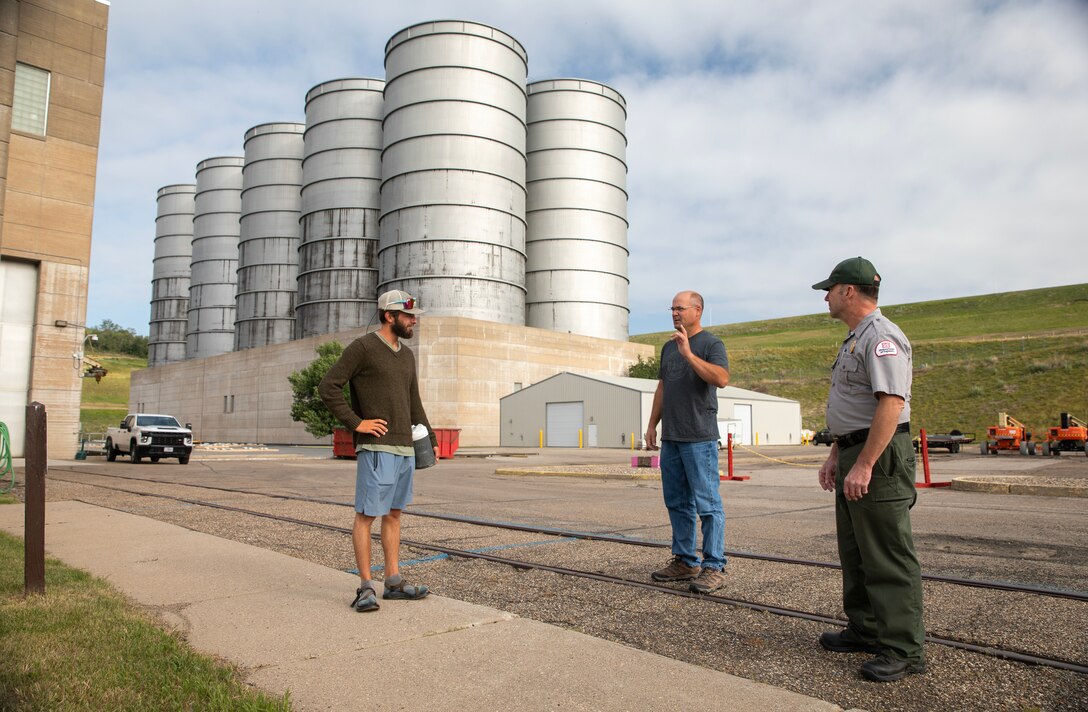 David Beck, operations project manager with the U.S. Army Corps of Engineers, Omaha District’s Garrison Dam Project in North Dakota, meets Kyle Parker, a paddler canoeing across the United States, at the dam’s powerhouse, July 18, 2025.