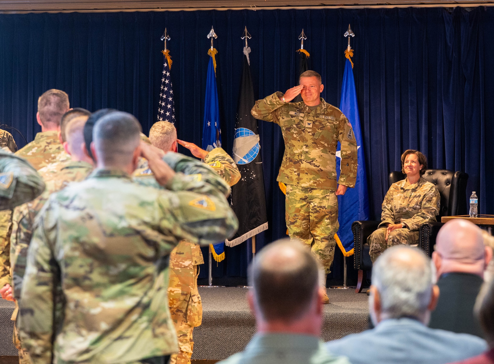U.S. Space Force (USSF) Space Systems Command’s (SSC) Battle Management, Command, Control, Communications, and Space Intelligence (BMC3I) Program Executive Office activates Systems Delta 85 (SYD 85) at Peterson Space Force Base on August 8, 2025. USSF Col. Jason West, SYD 85 commander, renders a salute to the members of SSC, BMC3I, and SYD 85. (U.S. Space Force photo by 2d Lt. Jacob S. Willoughby)