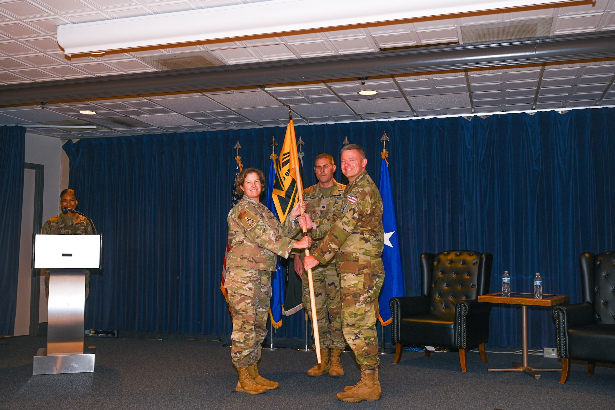 U.S. Space Force (USSF) Space Systems Command’s (SSC) Battle Management, Command, Control, Communications, and Space Intelligence (BMC3I) Program Executive Office activates Systems Delta 85 (SYD 85) at Peterson Space Force Base on August 8, 2025. USAF Brig. Gen. Michelle Idle, Mobilization Assistant to the Commander, Space Systems Command, passes the SYD 85 guidon to USSF Col. Jason West, SYD 85 commander.
