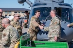 Lt. Col. Erik Greendyke, 40th Helicopter Squadron, Commander, shakes hands with Capt. Brock Flieger, 550th Helicopter Squadron flight commander, May 30, 2025 at Malmstrom Air Force Base, Mont. Completing Initial Operational Test and Evaluation successfully allows the U.S. Air Force to retire the UH-1N Huey fleet with the modern, safer, and more capable MH-139A. (U.S. Air Force photo by Airman 1st Class Jack Rodriguez Escamilla)