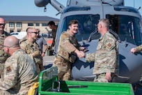 Lt. Col. Erik Greendyke, 40th Helicopter Squadron, Commander, shakes hands with Capt. Brock Flieger, 550th Helicopter Squadron flight commander, May 30, 2025 at Malmstrom Air Force Base, Mont. Completing Initial Operational Test and Evaluation successfully allows the U.S. Air Force to retire the UH-1N Huey fleet with the modern, safer, and more capable MH-139A. (U.S. Air Force photo by Airman 1st Class Jack Rodriguez Escamilla)