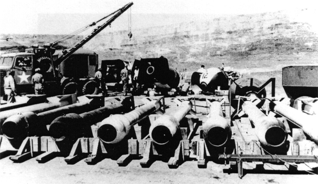 WENDOVER FIELD, Utah – Casings for the "Thin Man" plutonium gun design weapons being developed during the Manhattan Project as part of Project Alberta at Wendover Field, Utah (additional "Fat Man" test casings can be seen in the background as well). The plutonium gun design was eventually abandoned as infeasible, as the spontaneous fission rate of reactor-bred plutonium was much higher than expected.