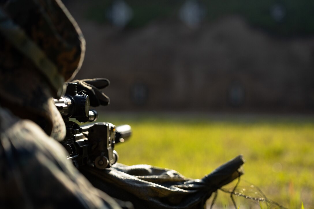 A U.S. Marine with 2nd Battalion, 23rd Marines, forward deployed with 4th Marine Regiment, 3d Marine Division as part of the Unit Deployment Program, adjusts his rifle combat optic on a battle sight zero range during the Korean Marine Exchange Program 25.2 in Pocheon, South Korea, July 26, 2025. KMEP is conducted regularly between the ROK and U.S. Marine Corps to increase their combined capabilities through realistic training geared towards deterrence and maintaining peace in the Indo-Pacific. (U.S. Marine Corps photo by Lance Cpl. Van Hoang)