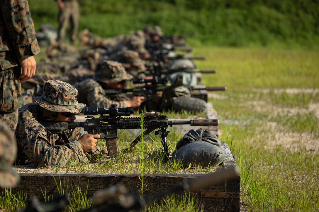 U.S. Marines with 2nd Battalion, 23rd Marines, forward deployed with 4th Marine Regiment, 3d Marine Division as part of the Unit Deployment Program, fire their M27 Infantry Automatic Rifles at a battle sight zero range during the Korean Marine Exchange Program 25.2 in Pocheon, South Korea, July 26, 2025. KMEP is conducted regularly between the ROK and U.S. Marine Corps to increase their combined capabilities through realistic training geared towards deterrence and maintaining peace in the Indo-Pacific. (U.S. Marine Corps photo by Lance Cpl. Van Hoang)