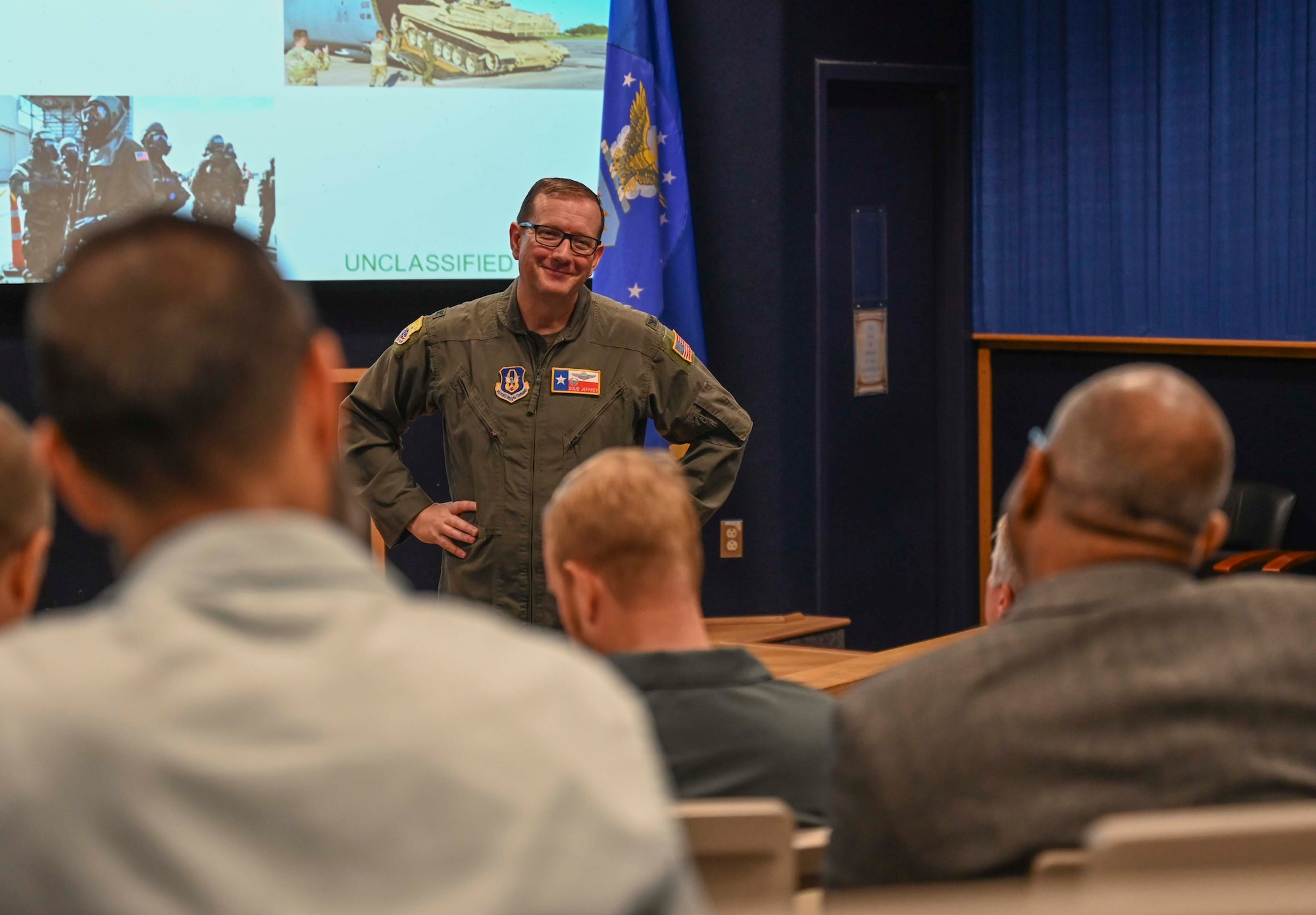 Greater San Antonio FBI Academy leadership and their civic leaders visit the 433rd Airlift Wing and receive a mission brief by Col. Douglas C. Jeffrey, IV, 433rd AW commander, before a C-5M Super Galaxy tour at Joint Base San Antonio-Lackland, Texas, Aug. 5, 2025.