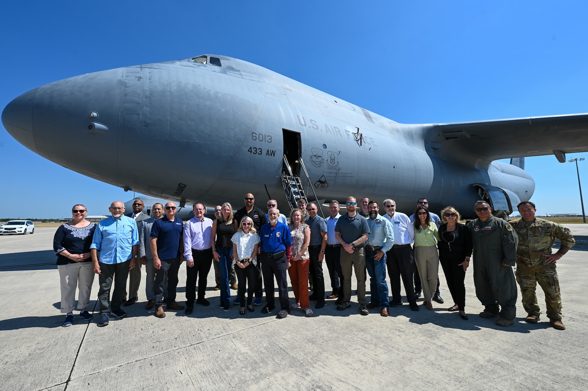 Greater San Antonio FBI Academy leadership and their civic leaders pose for a group photo with 433rd Airlift Wing Reserve Airmen during a C-5M Super Galaxy tour at Joint Base San Antonio-Lackland, Texas, Aug. 5, 2025.