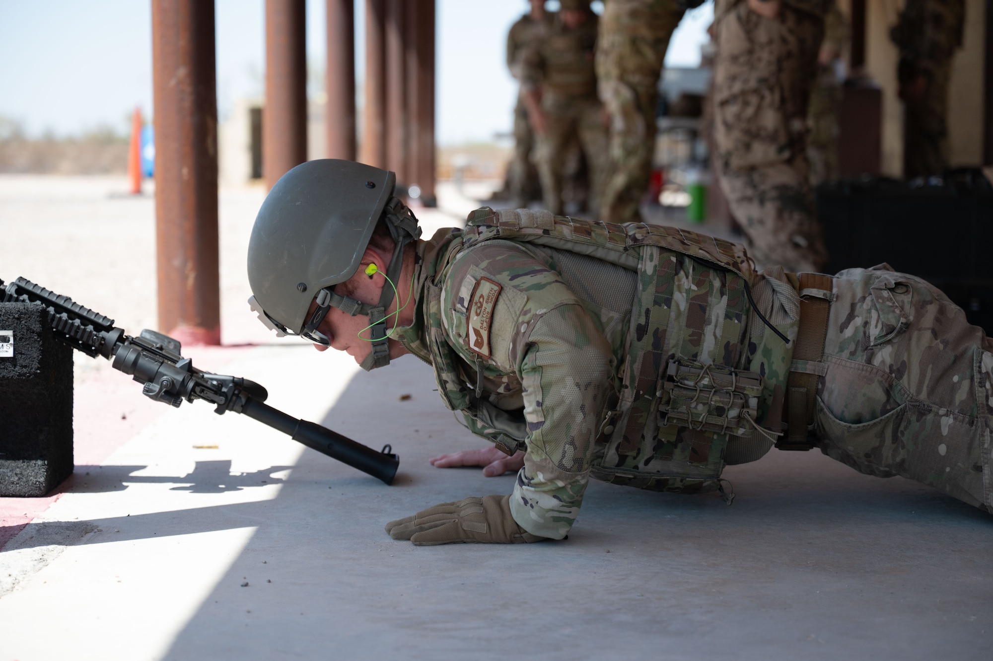 U.S. Air Force Tech. Sgt. Dalton Smith, 563rd Operations Support Squadron aircrew flight equipment craftsman, performs burpees during the German Armed Forces Schützenschnur event at Gila Bend, Arizona, August 8, 2025. Airmen from Fort Bliss, Texas, Holloman Air Force Base, New Mexico, and Davis-Monthan Air Force base, Arizona, participated in the event. (U.S. Air Force photo by Airman Jaden Kidd)