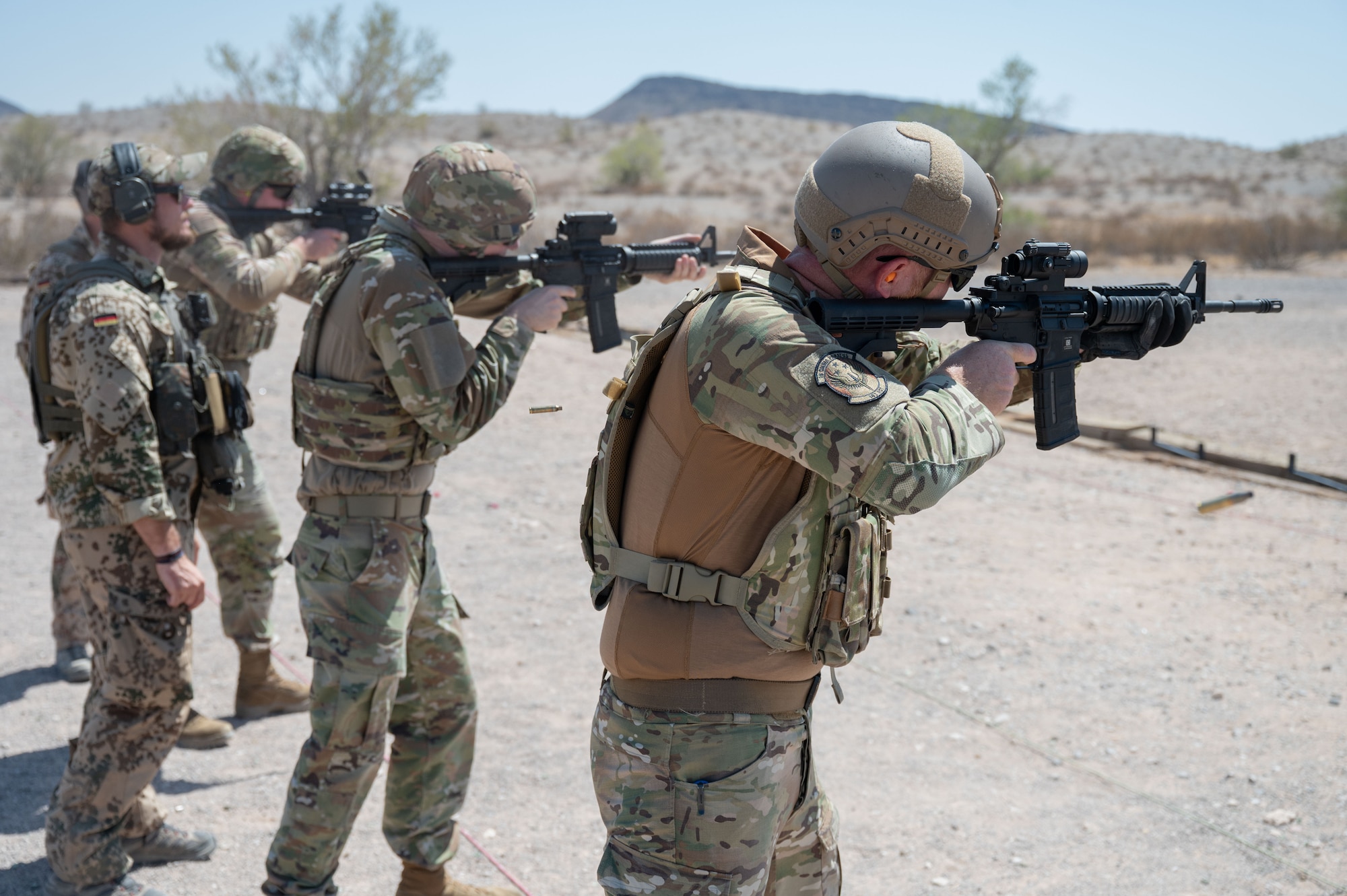 U.S. Air Force Airmen are graded by German Armed Forces members for the German Armed Forces Proficiency Badge, or Schützenschnur, at Gila Bend, Arizona, August 8, 2025. The event was held to strengthen ties between United States and German armed forces while maintaining lethality and readiness among Airmen. (U.S. Air Force photo by Airman Jaden Kidd)