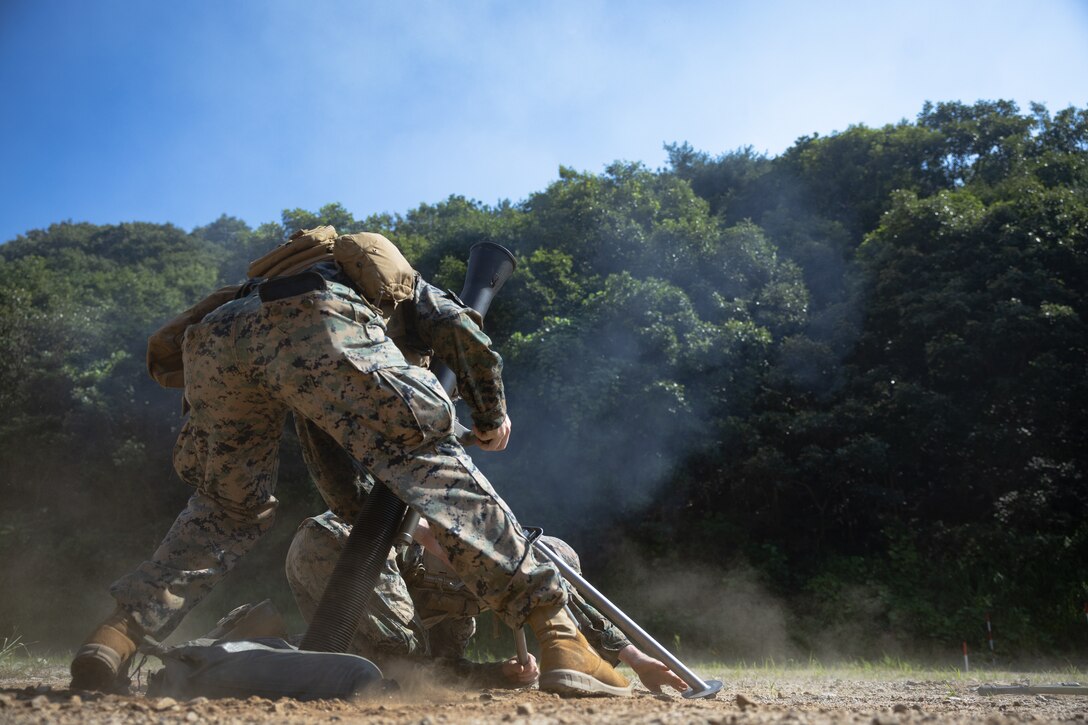 U.S. Marine Corps Cpl. Reece Frasier, a mortarman with 2nd Battalion, 23rd Marines, forward deployed with 4th Marine Regiment, 3d Marine Division as part of the Unit Deployment Program, fires an 81mm mortar round during the Korean Marine Exercise Program 25.2 in Pocheon, South Korea, July 28, 2025. KMEP is conducted regularly between the ROK and U.S. Marine Corps to increase their combined capabilities through realistic training geared towards deterrence and maintaining peace in the Indo-Pacific. (U.S. Marine Corps photo by Lance Cpl. Van Hoang)