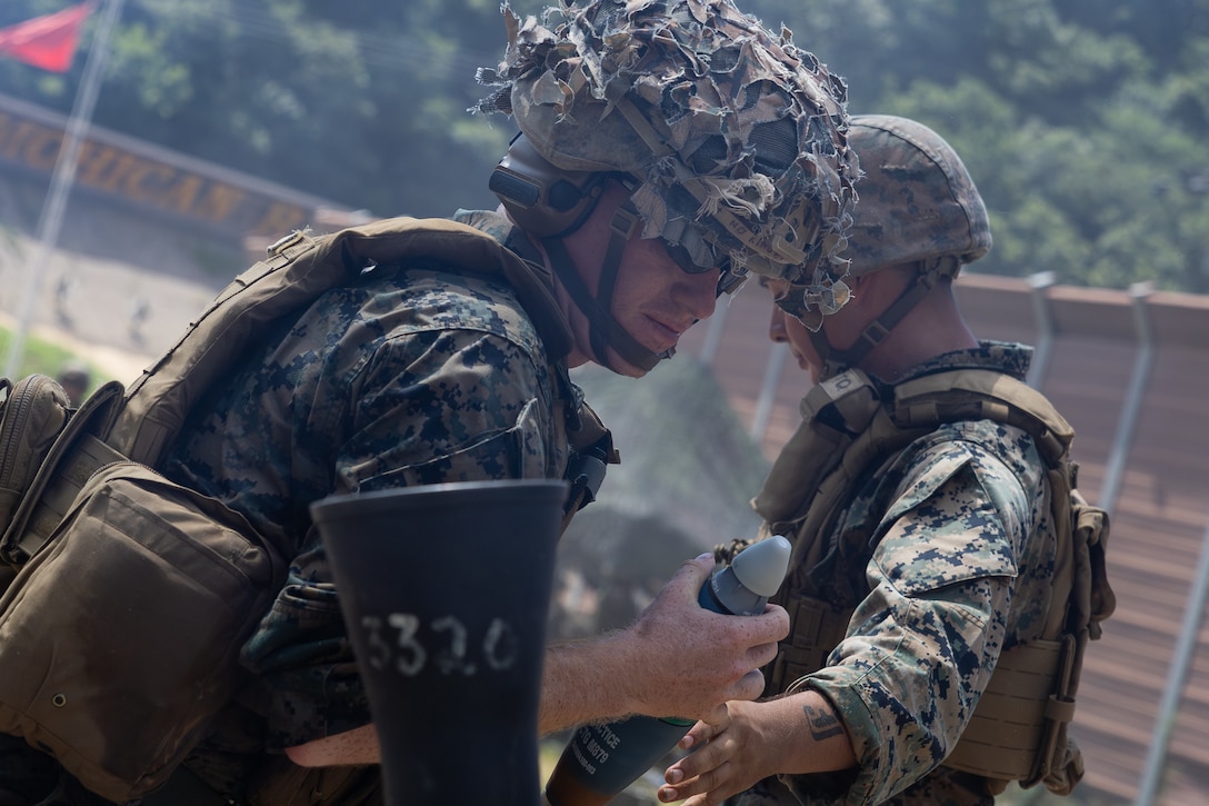 U.S. Marines with 2nd Battalion, 23rd Marines, forward deployed with 4th Marine Regiment, 3d Marine Division as part of the Unit Deployment Program, conduct a fire mission with an 81mm mortar during the Korean Marine Exercise Program 25.2 in Pocheon, South Korea, July 28, 2025. KMEP is conducted regularly between the ROK and U.S. Marine Corps to increase their combined capabilities through realistic training geared towards deterrence and maintaining peace in the Indo-Pacific. (U.S. Marine Corps photo by Lance Cpl. Van Hoang)