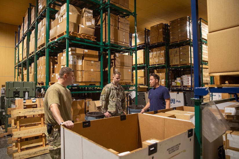 U.S. Army Staff Sgt. Preston Cook, a medical logistics specialist, Sgt. Marvin Wyler, a biomedical equipment specialist assigned to the 308th Medical Logistics Company, 145th Multifunctional Medical Battalion, 2nd Medical Brigade, and Mr. Ivan Cutler, a Logistics Specialist discuss inventory procedures at Sagami Supply Depot in Sagamihara, Japan July 14, 2025. Operation Patriot Press is a large-scale, multi-component logistics exercise that provides realistic training opportunities for the US Army Reserve, National Guard, and active-duty components to enhance their logistical acumen and readiness.