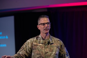 Chaplain (Maj. Gen.) Trent Davis, Air Force and Space Force chief of chaplains, gives a keynote speech at the annual Air Force Chaplain Corps Summit in Arlington, Va., Aug. 11, 2025. Davis announced the Chaplain Corps' new motto, 'HC Ready!', that focuses on fortifying the warfighter spirit, developing Chaplain Corps leaders and capabilities, and generating Religious Support Team readiness. (U.S. Air Force photo by Staff Sgt. Emmeline James)
