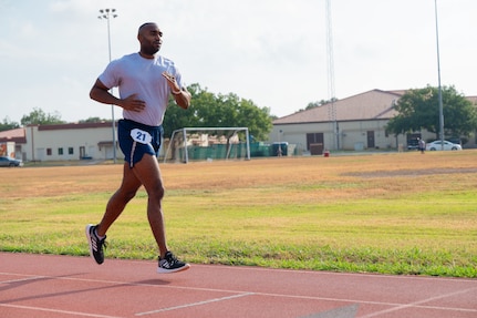 Airman runs on track outside.