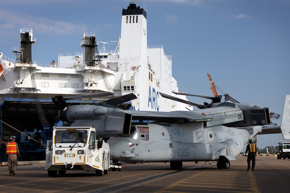 U.S. Marines load an MV-22 Osprey onto a vessel