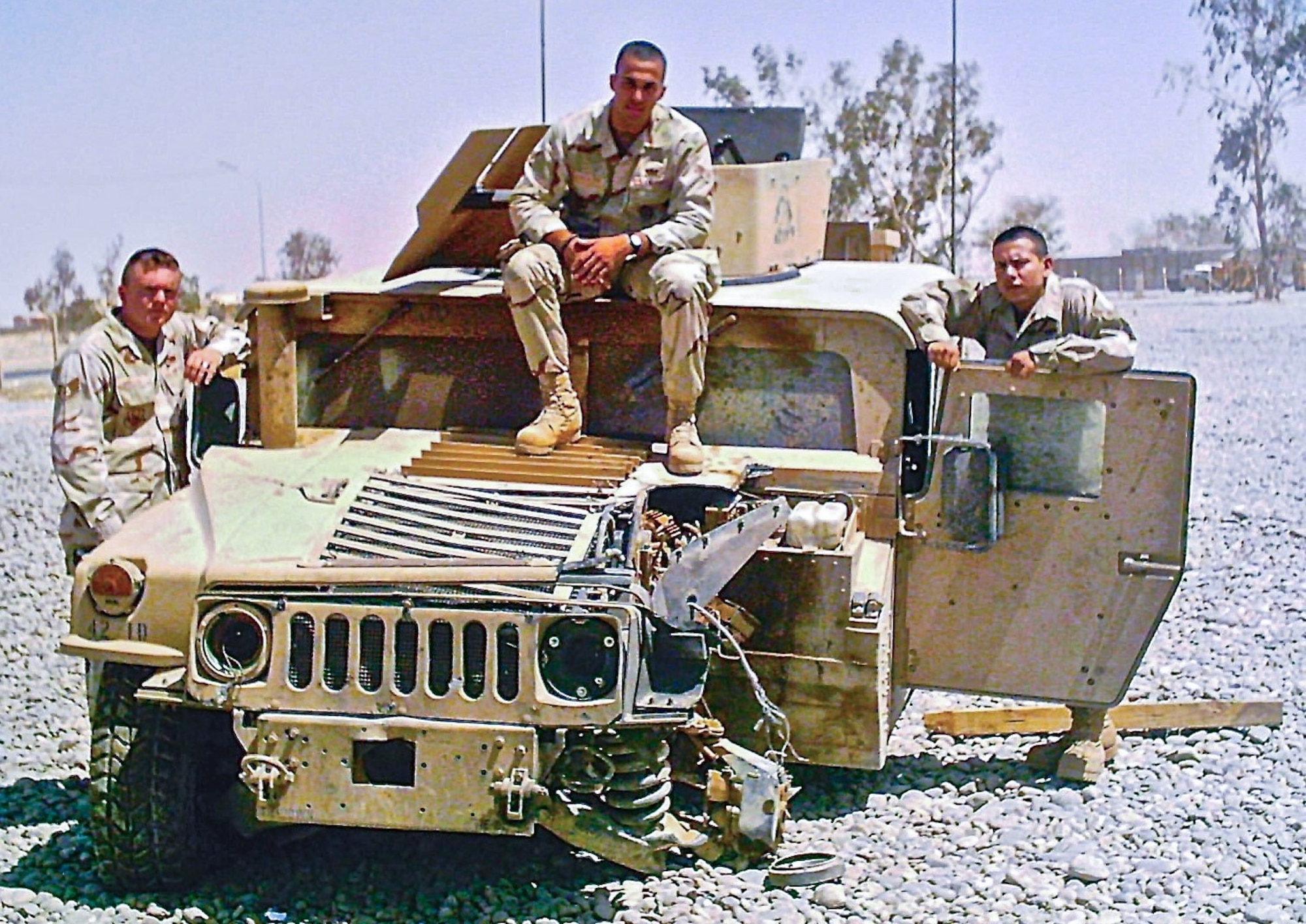 U.S. Air Force Chief Master Sgt. David A. Randolph, 30th Security Forces Squadron senior enlisted leader, then an Airman First Class, poses on a Humvee in July 2005 that was damaged by a landmine during a convoy to Mosul, Iraq, on June 22, 2005. Randolph and his team posed relative to the positions they were sitting in the Humvee during the attack. All three Airmen were awarded Purple Hearts for their injuries. While he physically recovered, Randolph endured years of suppressed emotional strain stemming from the incident. Randolph recently shared his story during a Hawk Talk event at Vandenberg Space Force Base, emphasizing the resilience of service members and the critical need for mental health support.