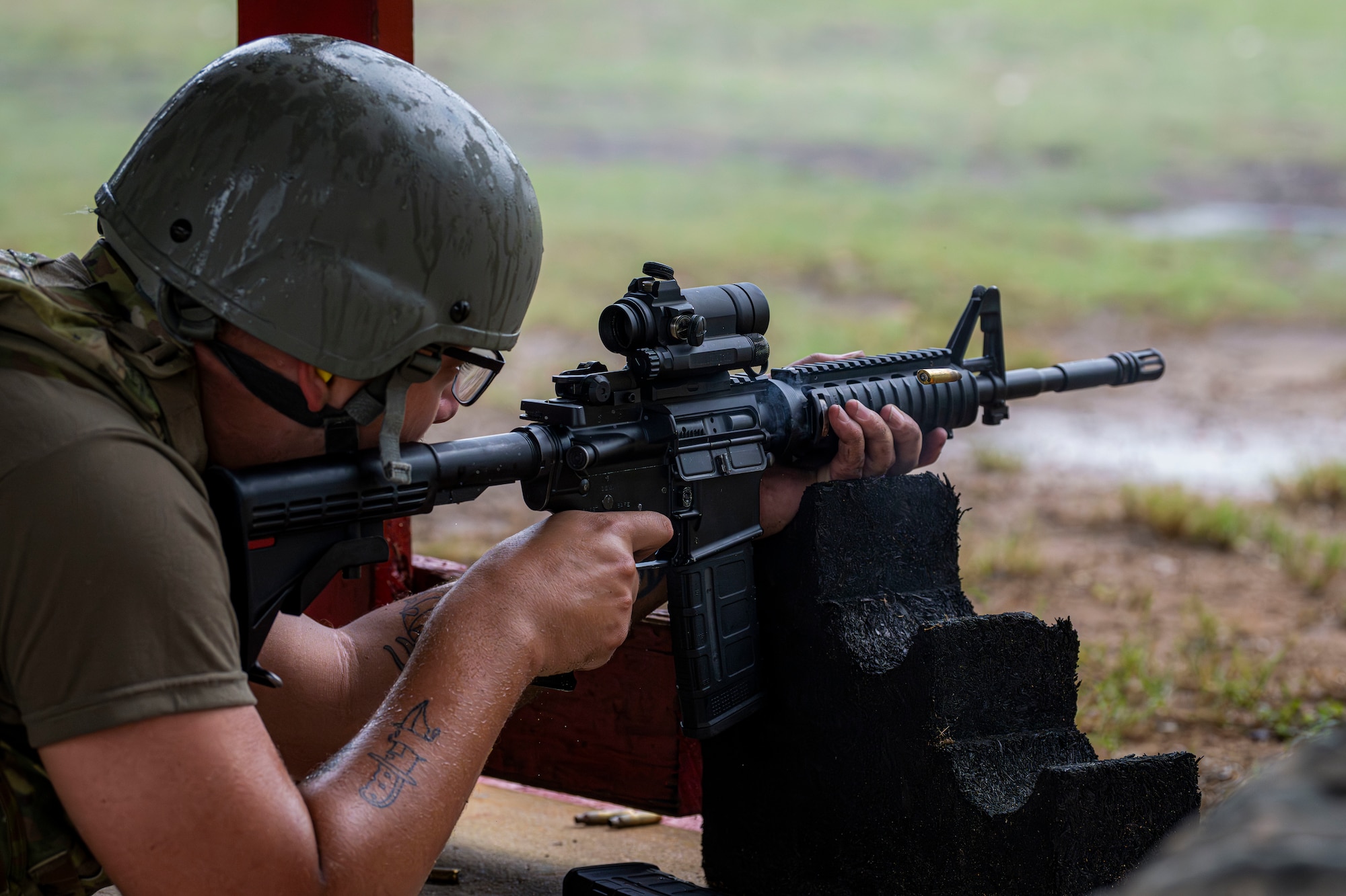 An Airman fires an M4 Carbine.