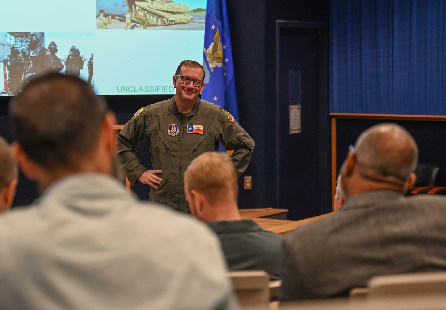 Greater San Antonio FBI Academy leadership and their civic leaders visit the 433rd Airlift Wing and receive a mission brief by Col. Douglas C. Jeffrey, IV, 433rd AW commander, before a C-5M Super Galaxy tour at Joint Base San Antonio-Lackland, Texas, Aug. 5, 2025.