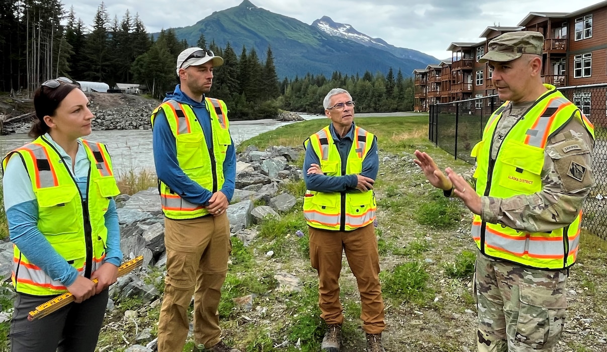 The Alaska District’s Olivia Jobin, hydraulic engineer and levee safety program manager, Mike Records, civil engineer, James Sauceda, chief of the Engineering Division, and Col. Jeffrey Palazzini, commander of the Alaska District, discuss the team’s data gathering work along the Mendenhall River on Aug. 14. Information taken from this year’s flood event will inform a technical study at the site for a potential long-term project.