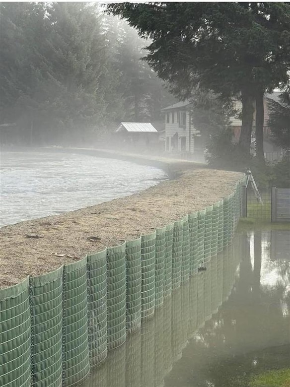 Originating from the USACE National Flood Fight Materiel Center in Illinois, about 37,800 linear feet of barrier wall; 400 supersacks; 112,000 sandbags and 25,000 linear feet of polyethylene sheeting were shipped to Juneau during the winter and spring of 2025 and strategically installed along the Mendenhall River by the City and Borough of Juneau in two phases. As the lead federal agency for floods, USACE provided technical assistance and advisement to the community through the process. (Courtesy photo)