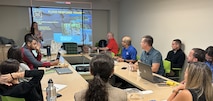 Group of people meeting about hurricane preparedness.