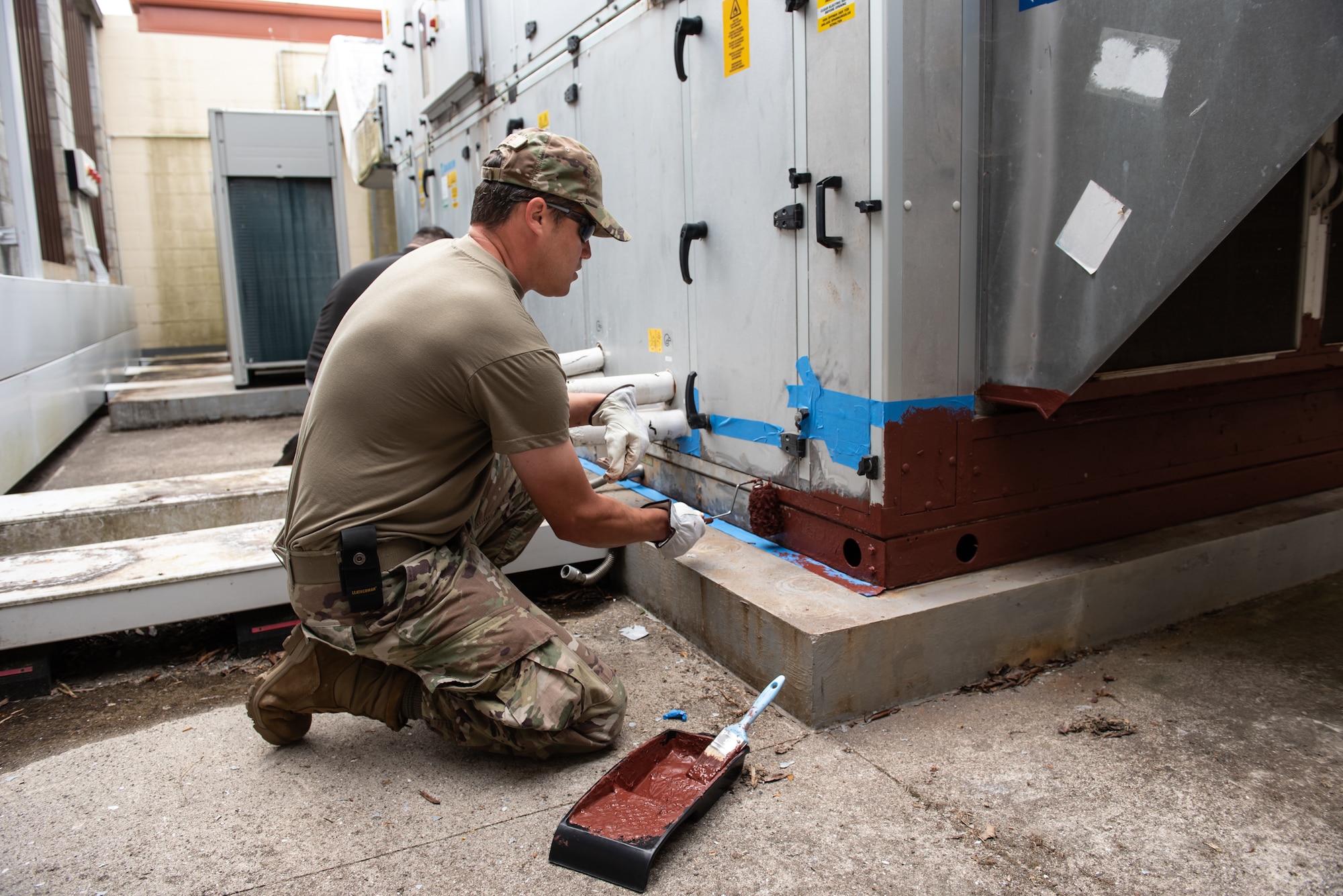 Staff Sgt. Daniel Morken from the Kentucky Air National Guard’s 123rd Civil Engineer Squadron applies anti-corrosion paint to ventilation equipment at Lajes Field, Azores, June 24, 2025. Airmen from the unit were tasked with base rejuvenation efforts across Lajes Field during a two-week deployment. (U.S. Air Force photo by Airman 1st Class Angelee Barnett)