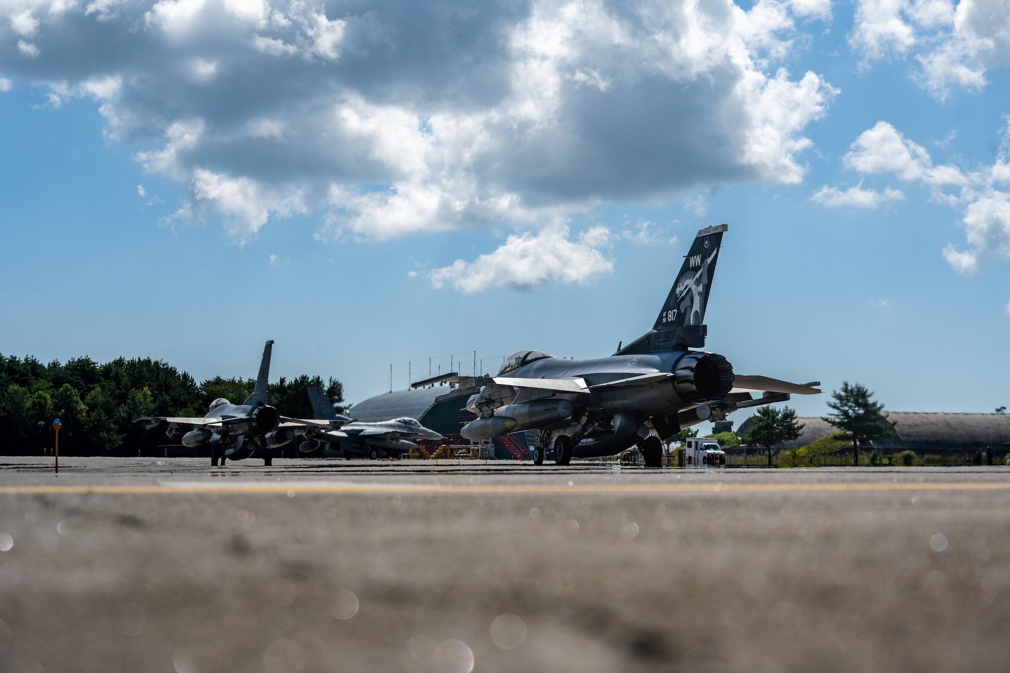U.S. Air Force F-16 Fighting Falcons assigned to the 13th Fighter Squadron taxi onto a flightline at Misawa Air Base, Japan, Aug. 13, 2025.