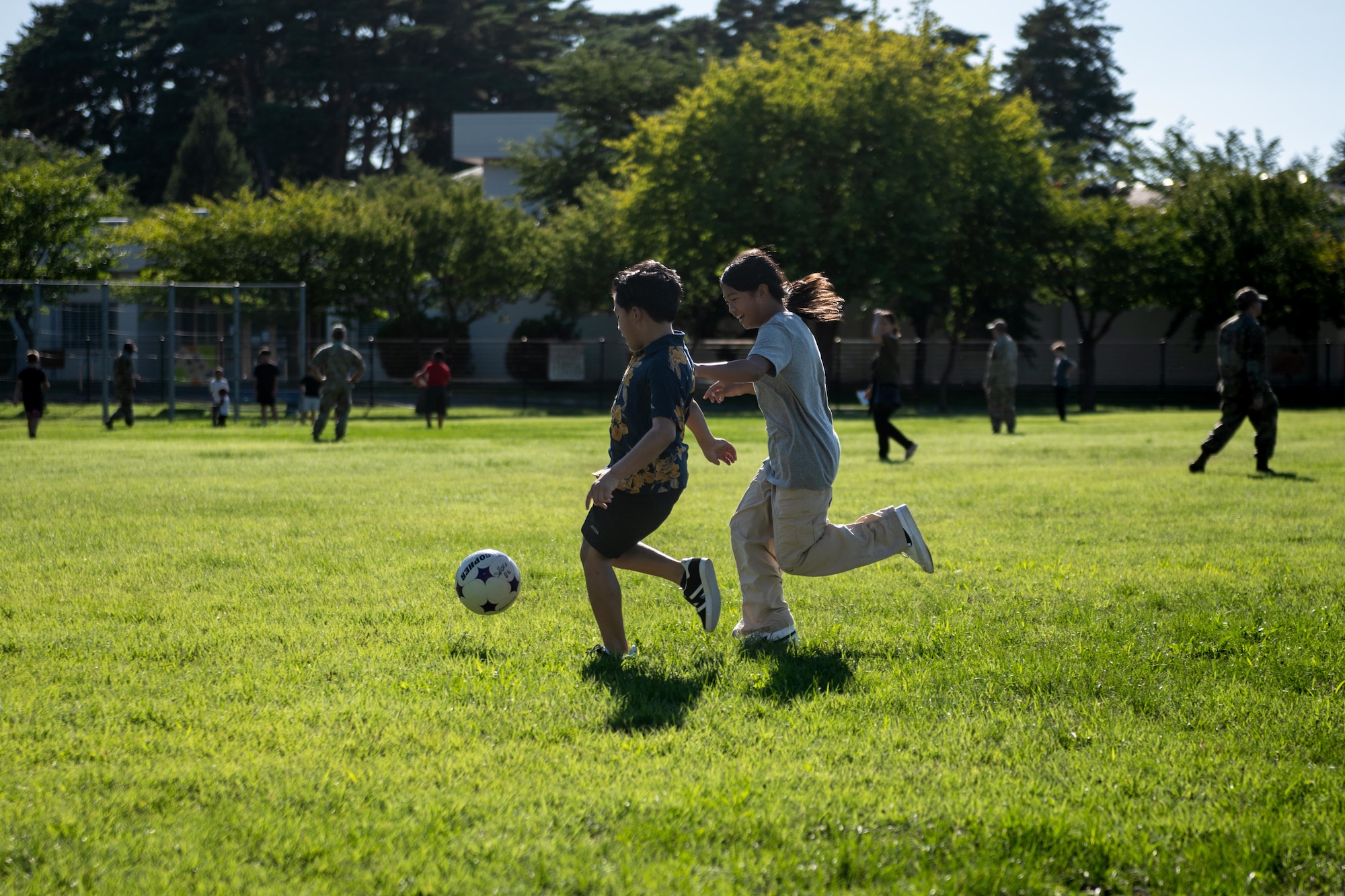 Students play soccer during a back to school bash event.