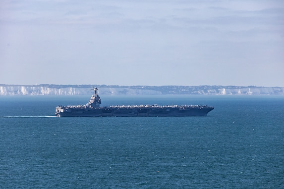 The world's largest aircraft carrier, USS Gerald R. Ford (CVN 78), passes the Cliffs of Dover in the English Channel, Aug. 17, 2025.