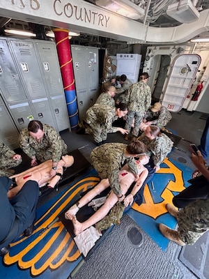 250805-N-WJ173-1001 SAN DIEGO (Aug. 5, 2025) – Sailors assigned to Navy Medicine Readiness and Training Command San Diego (NMRTC SD) Casualty Receiving and Treatment Ship (CRTS) Teams 2, 8, and 9 conduct casualty assessment and treatment drills on a medical training mannequin aboard the Wasp-class amphibious assault ship USS Boxer (LHD 4) during amphibious familiarization training, Aug. 5, 2025. The multi-team evolution, coordinated by Naval Medical Forces Pacific (NMFP) and NMRTC SD, is designed to sustain medical readiness and operational integration with amphibious warfare platforms in support of deployed Marine Air Ground Task Forces (MAGTF) and Naval Expeditionary Forces. (U.S. Navy photo contributed)