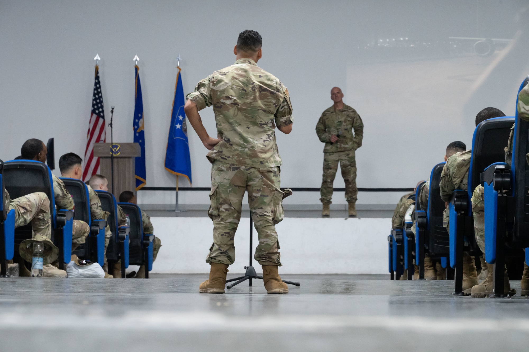 Chief Master Sgt. of the Air Force David Flosi answers questions during an address to Airmen assigned to the 379th Air Expeditionary Wing within the U.S. Central Command area of responsibility, Aug. 12, 2025. During the address, Flosi highlighted topics including force readiness, resiliency and the strategic role the 379th AEW plays in regional operations. (U.S. Air Force photo by Dieondiere Jefferies)