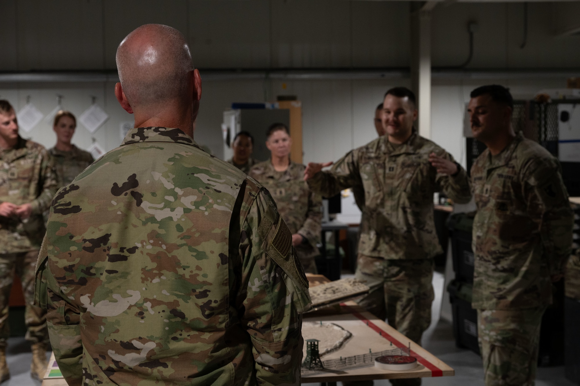 Chief Master Sgt. of the Air Force David Flosi learns about the duties of soldiers assigned to the 2-1 Air Defense Artillery Battalion within the U.S. Central Command area of responsibility, Aug. 12, 2025. The visit gave CMSAF the opportunity to engage directly with Airmen and soldiers across the CENTCOM AOR, address their concerns, and recognize their contributions to regional security. (U.S. Air Force photo by Dieondiere Jefferies)