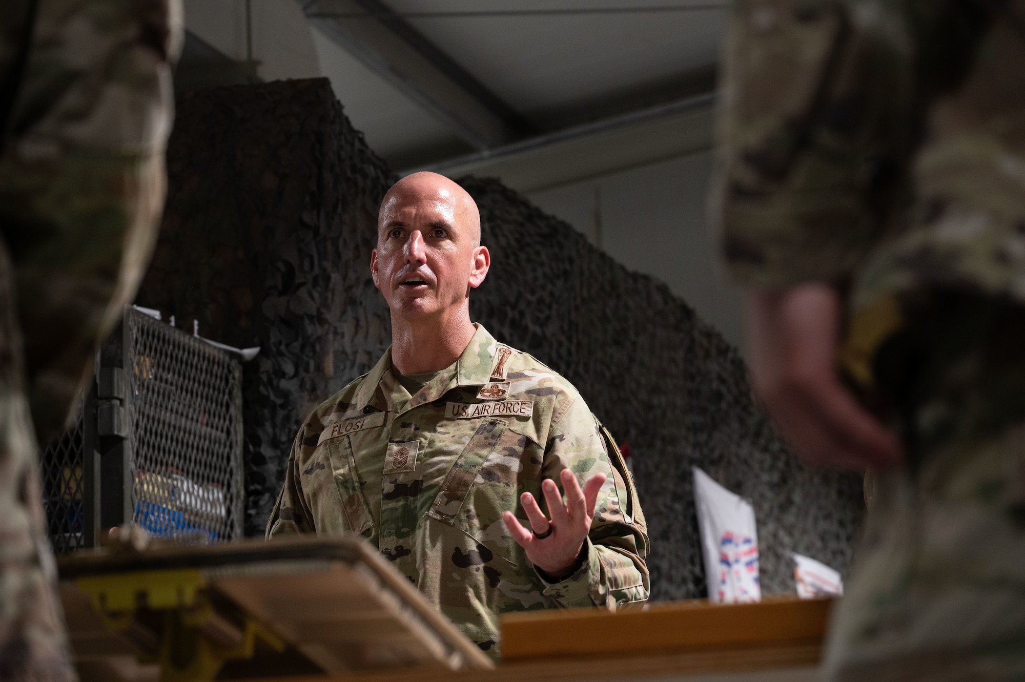 Chief Master Sgt. of the Air Force David Flosi speaks with soldiers assigned to the 2-1 Air Defense Artillery Battalion within the U.S. Central Command area of responsibility, Aug. 12, 2025. The visit gave CMSAF the opportunity to engage directly with Airmen and soldiers across the CENTCOM AOR, address their concerns, and recognize their contributions to regional security. (U.S. Air Force photo by Dieondiere Jefferies)