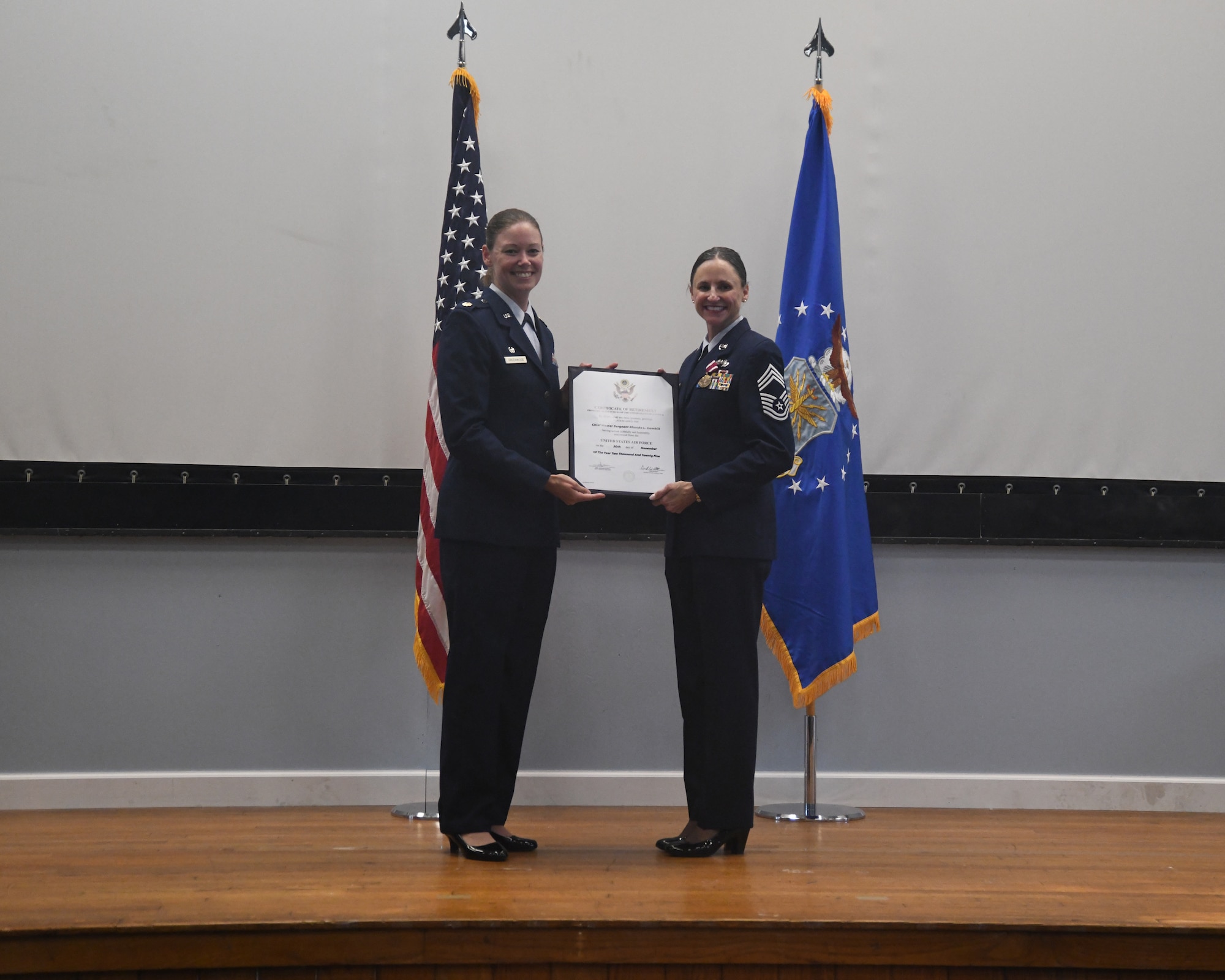 Chief Master Sgt. Rhonda Gambill retires from the Air Force after serving nearly 30 years of total military service. Chief Gambill, who began her military career as a Marine, retired as the Senior Enlisted Leader for the 459th Mission Support Group at Joint Base Andrews, Md. Gambill held her retirement ceremony at the 459th Air Refueling Wing. Maj. Melissa Greenwood, 46th Aerial Port Squadron, Dover AFB, Del., officiated the ceremony. (U.S. Air Force photo by Lt. Col. Timothy Smith)