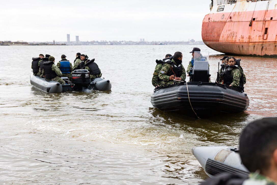 Uruguayan Infantes de Marina dock rigid inflatable boats during a subject matter expert exchange in Uruguay, August 14, 2025. This subject matter expert exchange enhances the training and readiness standards for the United States and Uruguay as well as facilitating the exchange of formalized readiness standards between both countries. (U.S. Marine Corps photo by Sgt. Eduardo Delatorre)