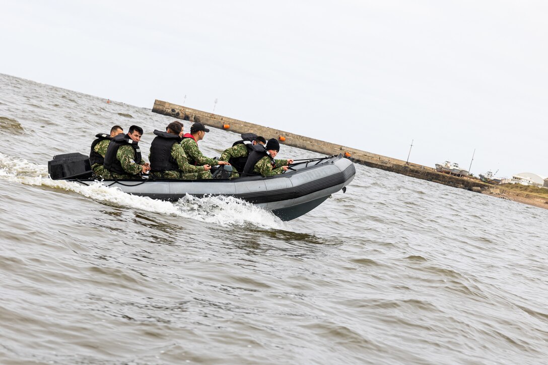 Uruguayan Infantes de Marina ride rigid inflatable boats during a subject matter expert exchange in Uruguay, August 14, 2025. This subject matter expert exchange enhances the training and readiness standards for the United States and Uruguay as well as facilitating the exchange of formalized readiness standards between both countries. (U.S. Marine Corps photo by Sgt. Eduardo Delatorre)