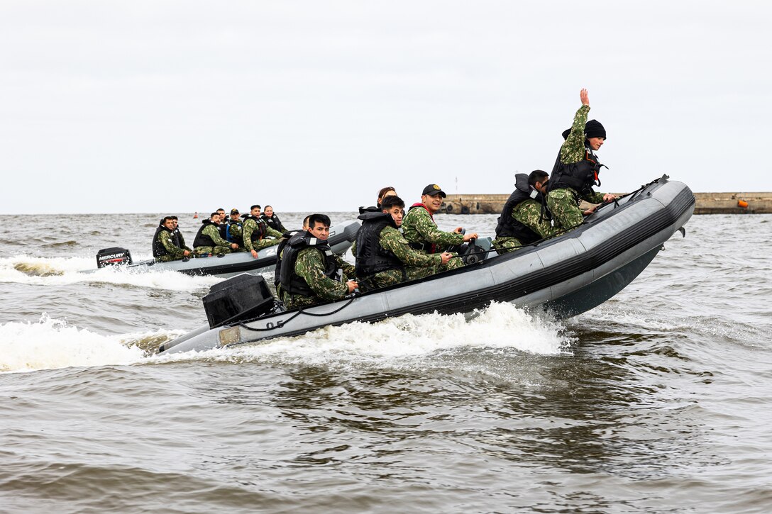 Uruguayan Infantes de Marina ride rigid inflatable boats during a subject matter expert exchange in Uruguay, August 14, 2025. This subject matter expert exchange enhances the training and readiness standards for the United States and Uruguay as well as facilitating the exchange of formalized readiness standards between both countries. (U.S. Marine Corps photo by Sgt. Eduardo Delatorre)
