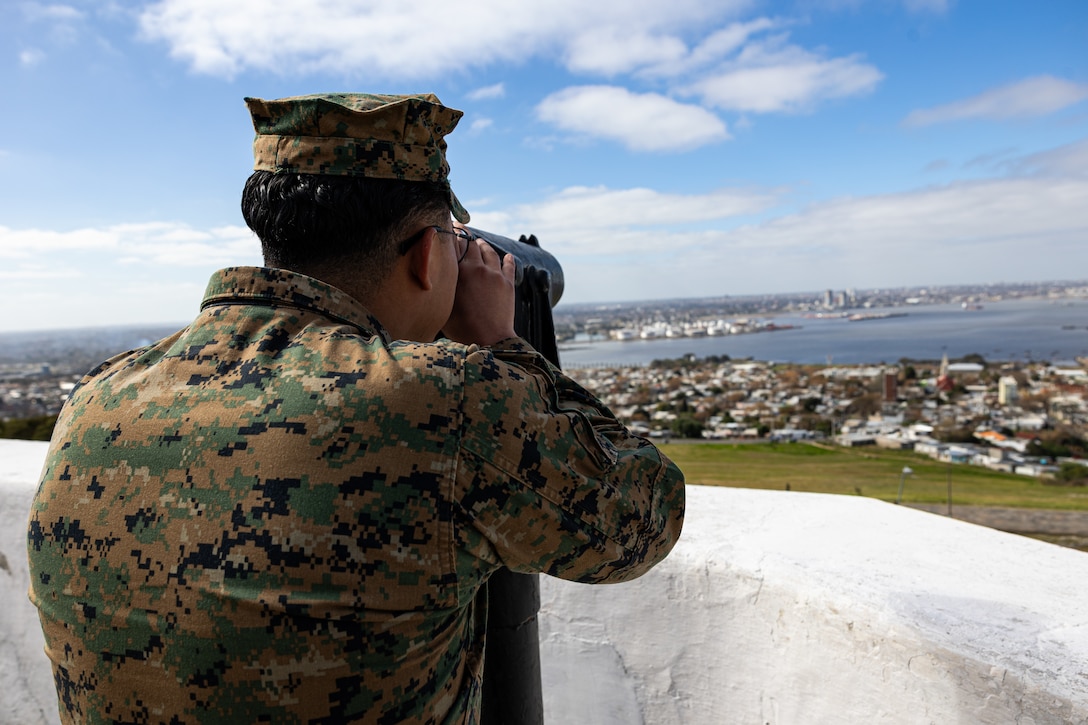 U.S. Marine Corps Sgt. Ronald Arce, an infantry rifleman with U.S. Marine Corps Forces, South, looks through a telescope during a subject matter expert exchange in Uruguay, August 14, 2025. This subject matter expert exchange enhances the training and readiness standards for the United States and Uruguay as well as facilitating the exchange of formalized readiness standards between both countries. Arce is a native of Texas. (U.S. Marine Corps photo by Sgt. Eduardo Delatorre)
