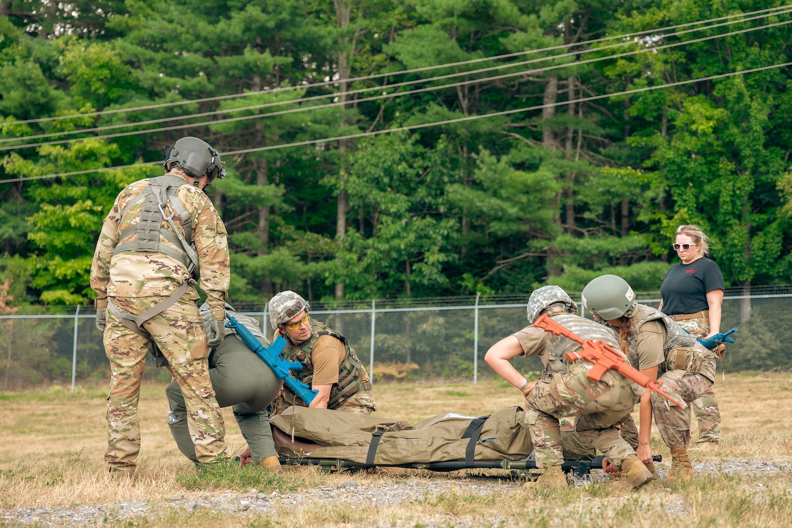 A team of Tactical Combat Casualty Care (TCCC) students conducts medical training during an exercise Aug. 14, 2025, at the Bangor Air National Guard Base, Bangor, ME.