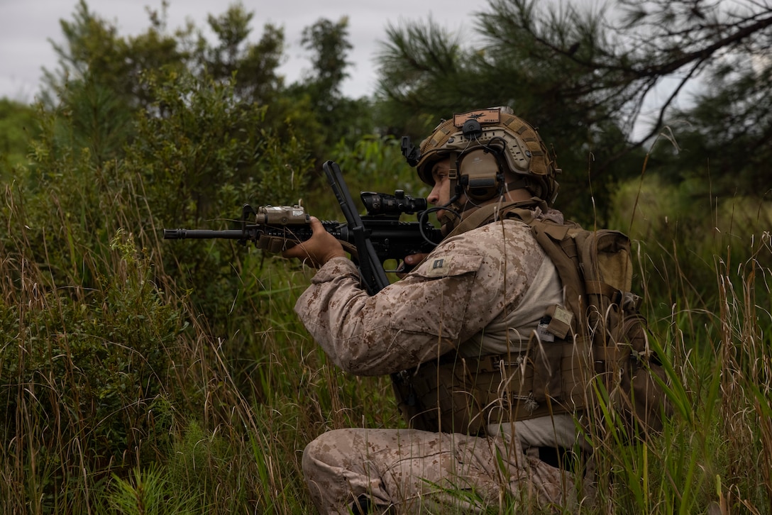 U.S. Marine Corps Capt. Nathaniel Fuiten, a field artillery officer with 2nd Air Naval Gunfire Liaison Company, II Marine Expeditionary Force Information Group, posts security during exercise Burmese Chase 25 at Marine Corps Base Camp Lejeune, North Carolina, Aug. 12, 2025. Burmese Chase is an annual U.S. led, multi-lateral training exercise comprised of integrating ground and air fires, infantry tactics and naval gunfire alongside NATO allies to enhance combat readiness and interoperability. (U.S. Marine Corps photo by LCpl. Payton Walley)