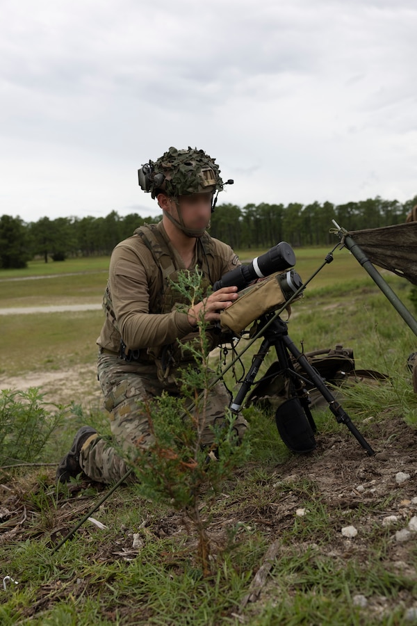 A Dutch Marine with 25 RSTA Squadron, prepares a Type 163 laser target designator during exercise Burmese Chase 25 at Marine Corps Base Camp Lejeune, North Carolina, Aug. 12, 2025. Burmese Chase is an annual U.S. led, multi-lateral training exercise comprised of integrating ground and air fires, infantry tactics and naval gunfire alongside NATO allies to enhance combat readiness and interoperability. (U.S. Marine Corps photo by LCpl. Payton Walley) (This photo has been altered for security purposes by blurring out faces.)