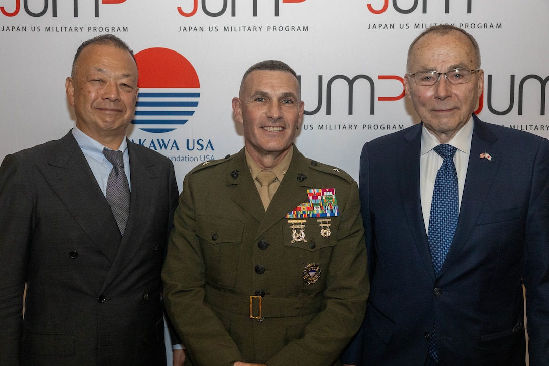 Dr. Satohiro Akimoto, left, director of the Japan U.S. Military Program, U.S. Marine Corps Brig. Gen. Ralph J. Rizzo, center, commanding general, Marine Corps Installations East-Marine Corps Base (MCB) Camp Lejeune, and retired U.S. Marine Corps Lt. Gen. Wallace “Chip” Gregson, right, distinguished senior fellow (non-resident), Sasakawa Peace Foundation USA, pose for a photo during the Japan U.S. Military Program dinner on MCB Camp Lejeune, Aug. 6, 2025. The Japan U.S. Military Program connects U.S. service members, families and civilians who have served in Japan through a partnership between Sasakawa Peace Foundation USA, the Embassy of Japan and the National Association of Japan-America Societies. (U.S. Marine Corps photo by Lance Cpl. Erica S. Padgett)